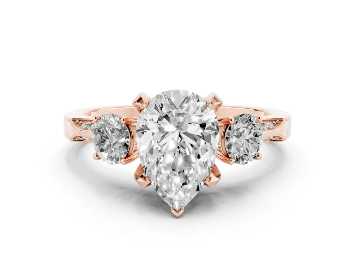 Pear Cut Diamond Three-Stone Ring Set in Rose gold with Pavé Band and Smaller Side Stones