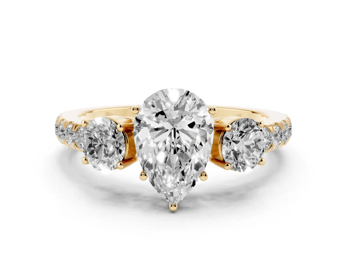 Pear Cut Diamond Three-Stone Ring Set in Yellow gold with Round Side Stones and Delicate Pavé Band