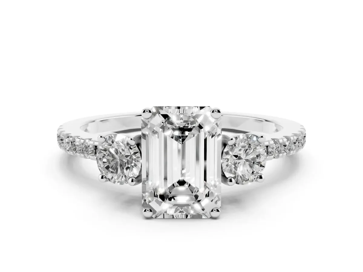 Emerald Cut Diamond Three-Stone Ring Set in Platinum with Pavé Band and Graduated Sides