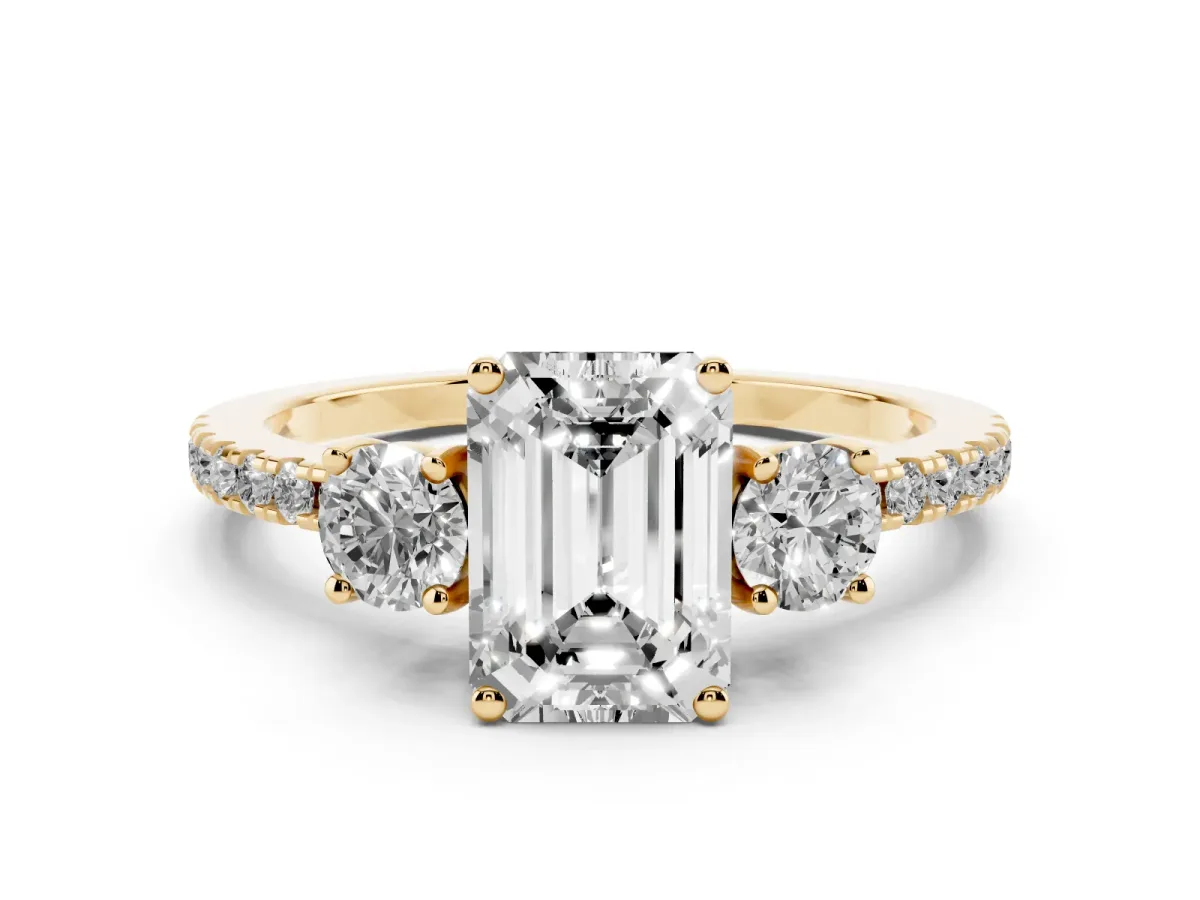 Emerald Cut Diamond Three-Stone Ring Set in Yellow gold with Pavé Band and Graduated Sides