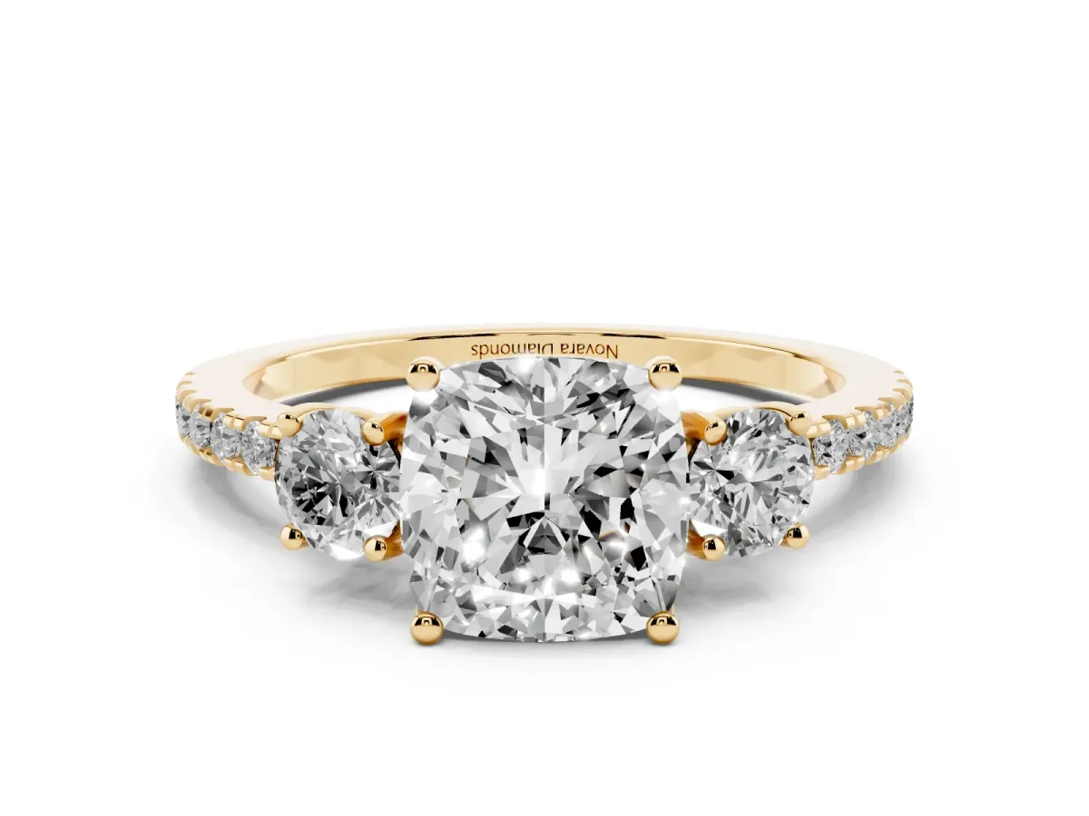 Cushion Cut Diamond Three-Stone Ring Set in Yellow gold with Pavé Band and Graduated Sides