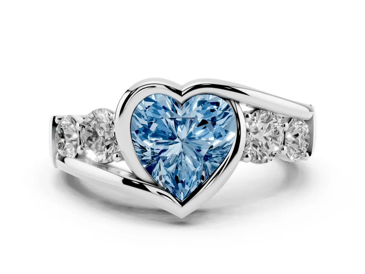 Fancy Blue Heart Cut Diamond Bezel Bypass Ring Set in Silver with Round Accents