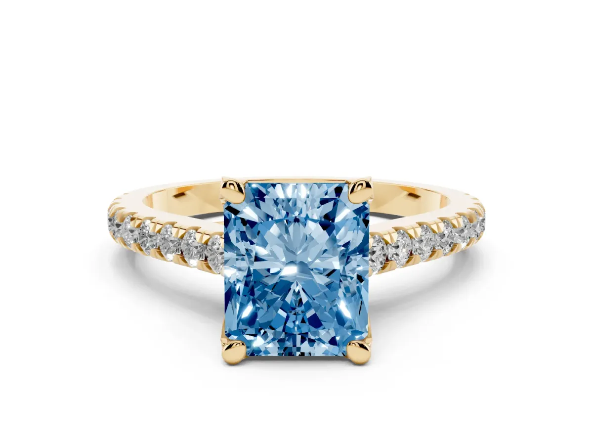 Fancy Blue Radiant Cut Diamond Solitaire Ring Set in Yellow gold with Brilliant Pavé Band and Prong Setting