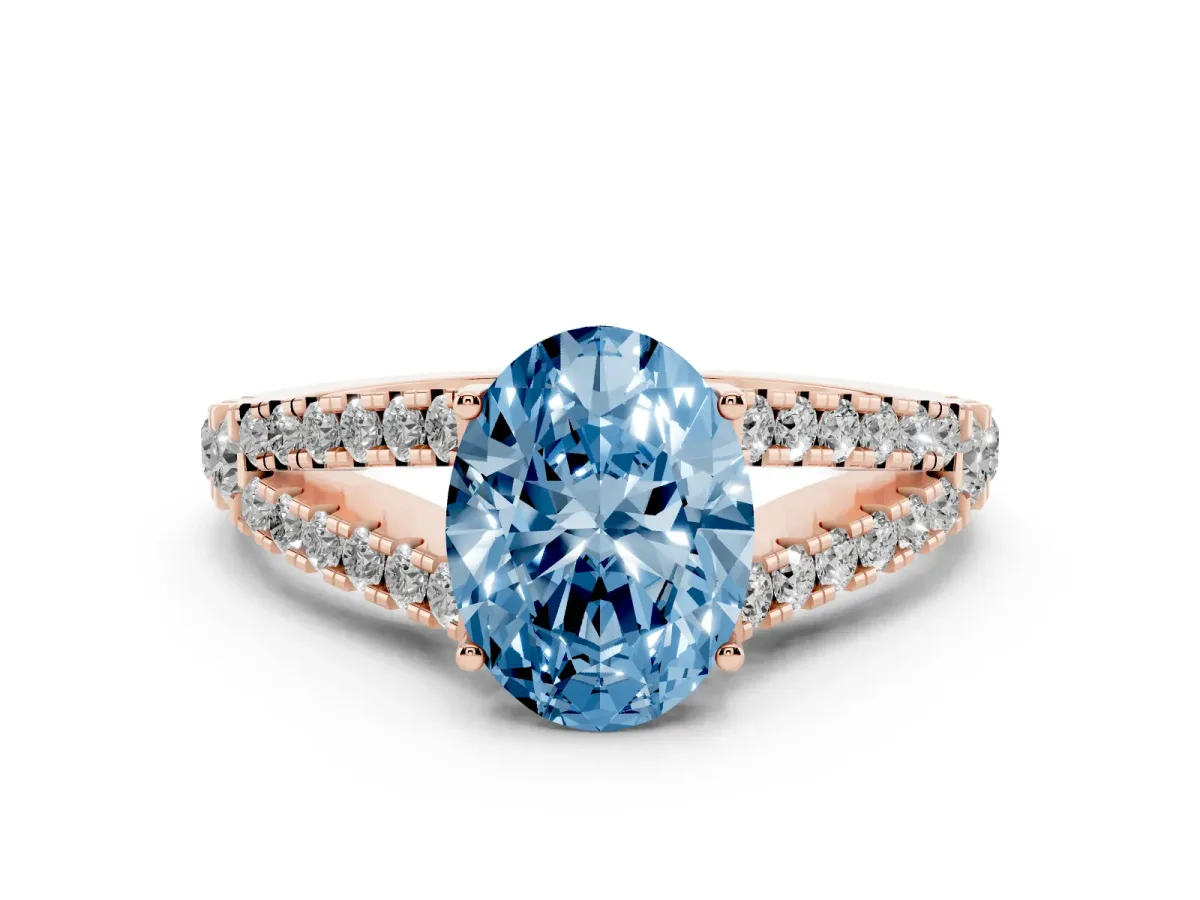 Fancy Blue Oval Cut Diamond Split Shank Pavé Engagement Ring Set in Rose gold with Prong-Held Center Stone