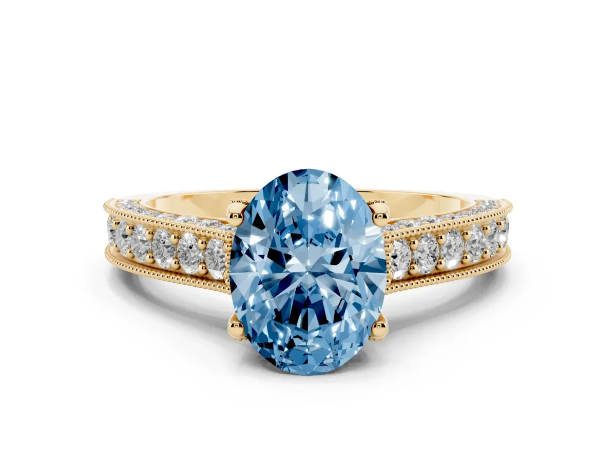 Fancy Blue Oval Cut Diamond Solitaire Ring Set in Yellow gold with Milgrain-Edged Pavé Band and Prong Setting