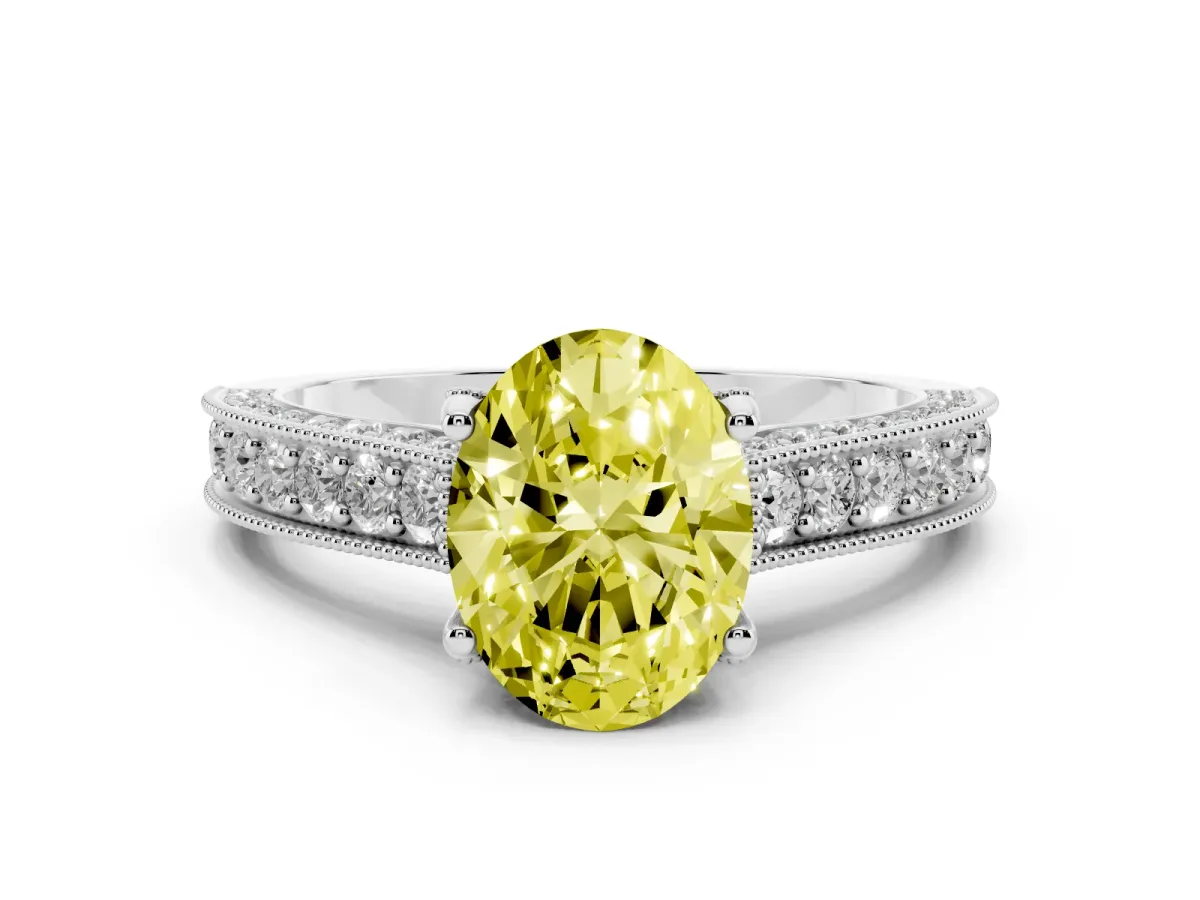 Fancy Yellow Oval Cut Diamond Solitaire Ring Set in White gold with Milgrain-Edged Pavé Band and Prong Setting