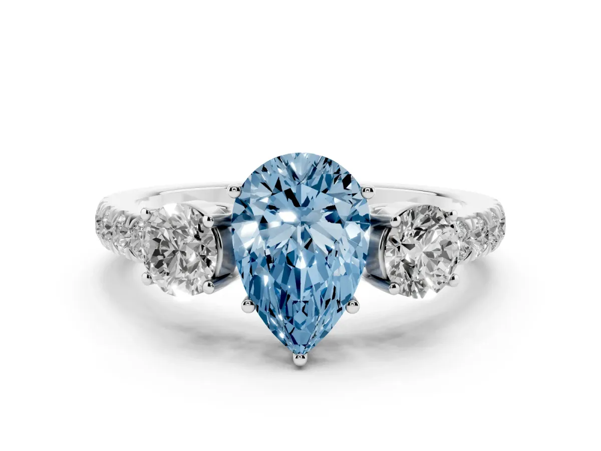 Fancy Blue Pear Cut Diamond Three-Stone Ring Set in Silver with Round Side Stones and Delicate Pavé Band