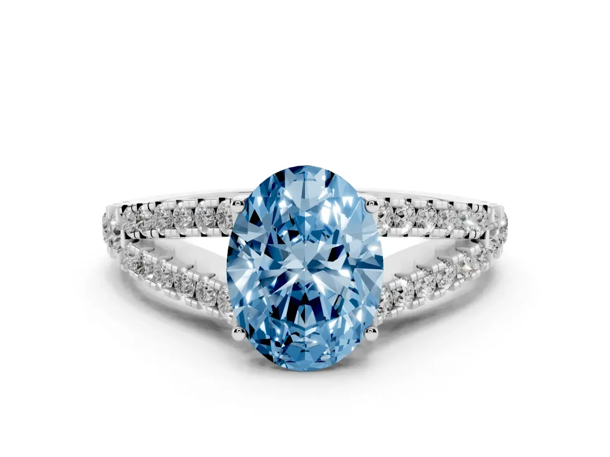 Fancy Blue Oval Cut Diamond Split Shank Pavé Engagement Ring Set in Platinum with Prong-Held Center Stone