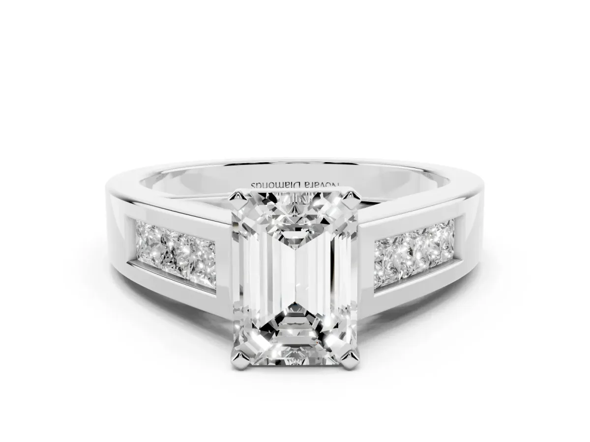 Emerald Cut Diamond Solitaire Ring Set in White gold with Channel-Set Accent Stones and Prong Setting