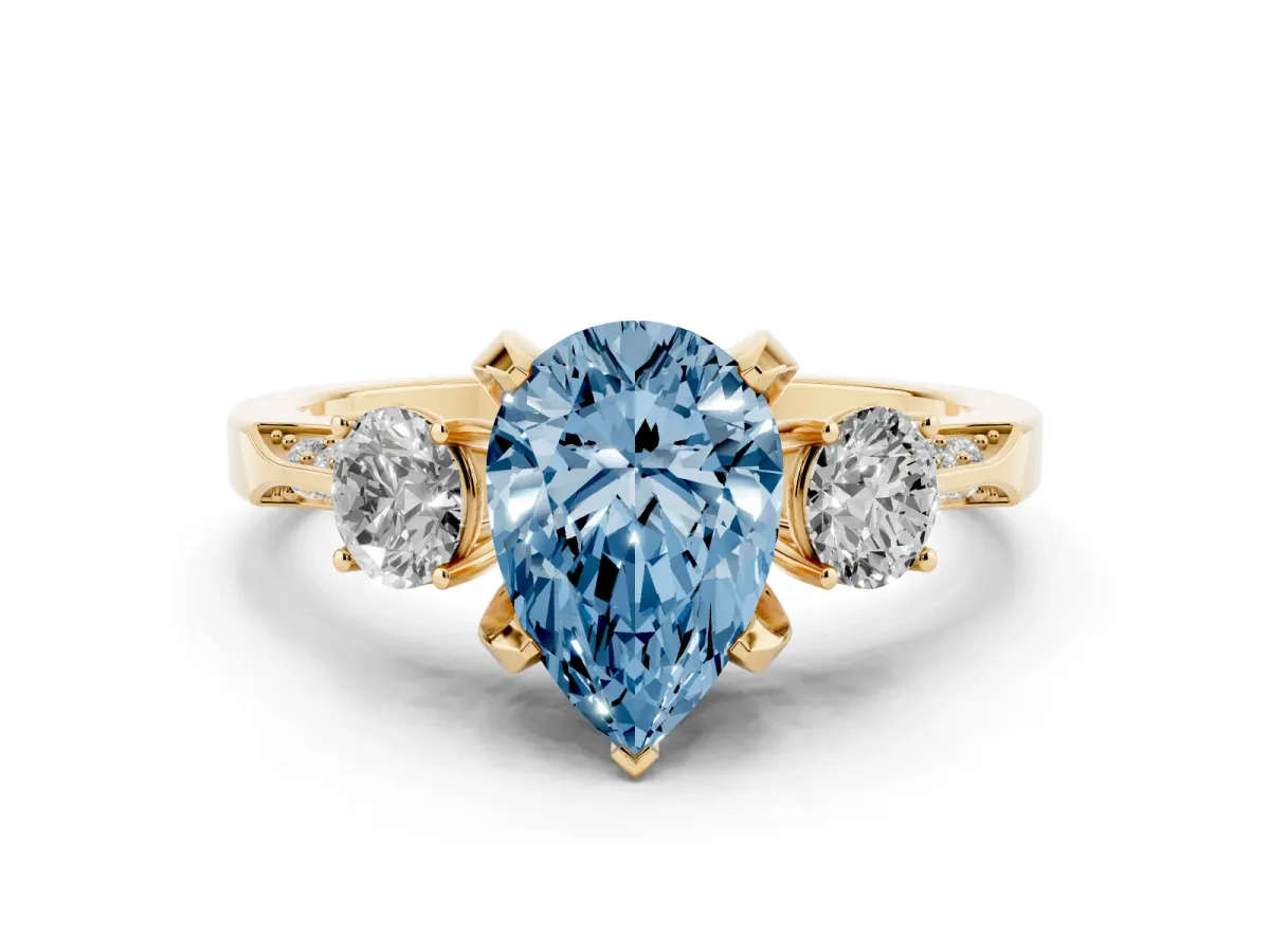 Fancy Blue Pear Cut Diamond Three-Stone Ring Set in Yellow gold with Pavé Band and Smaller Side Stones