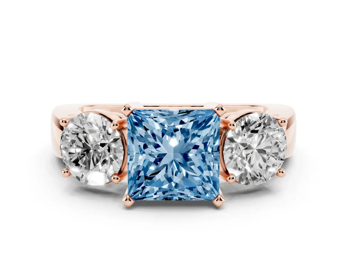 Fancy Blue Princess Cut Diamond Three-Stone Ring Set in Rose gold with Round Side Stones and Classic Band