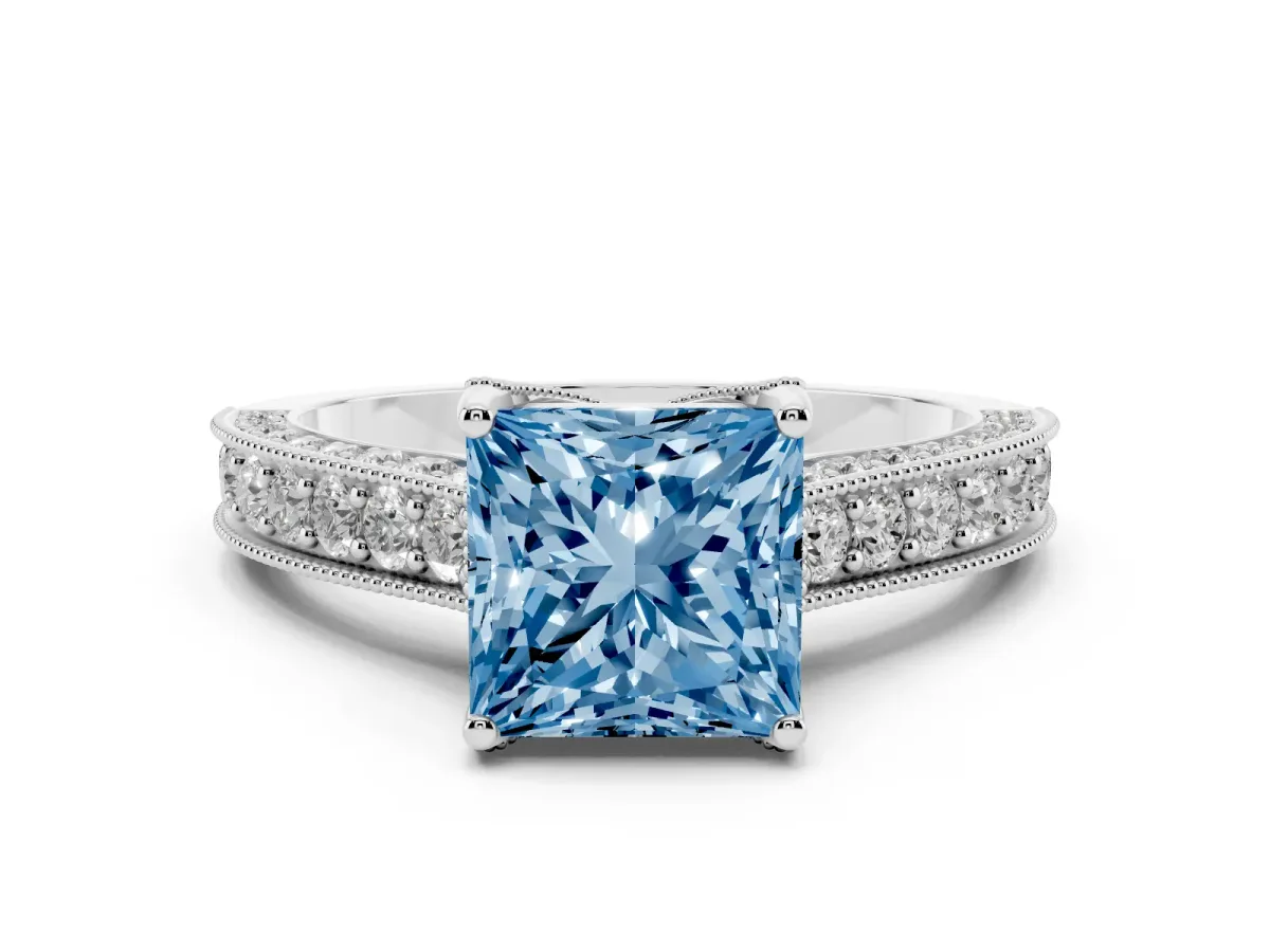 Fancy Blue Princess Cut Diamond Solitaire Ring Set in Silver with Milgrain-Edged Pavé Band and Prong Setting