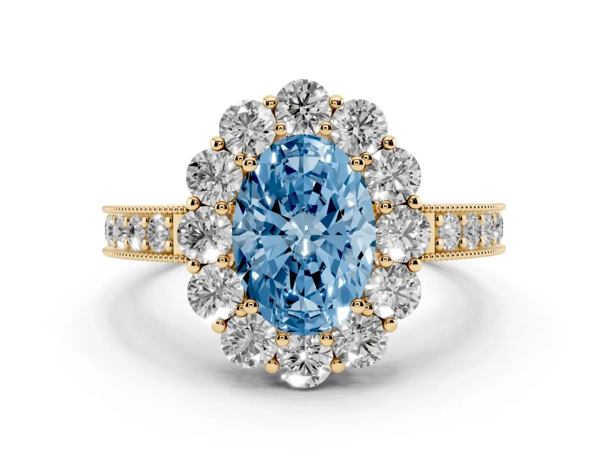 Fancy Blue Oval Cut Diamond Halo Pavé Engagement Ring Set in Yellow gold with Milgrain Detailing