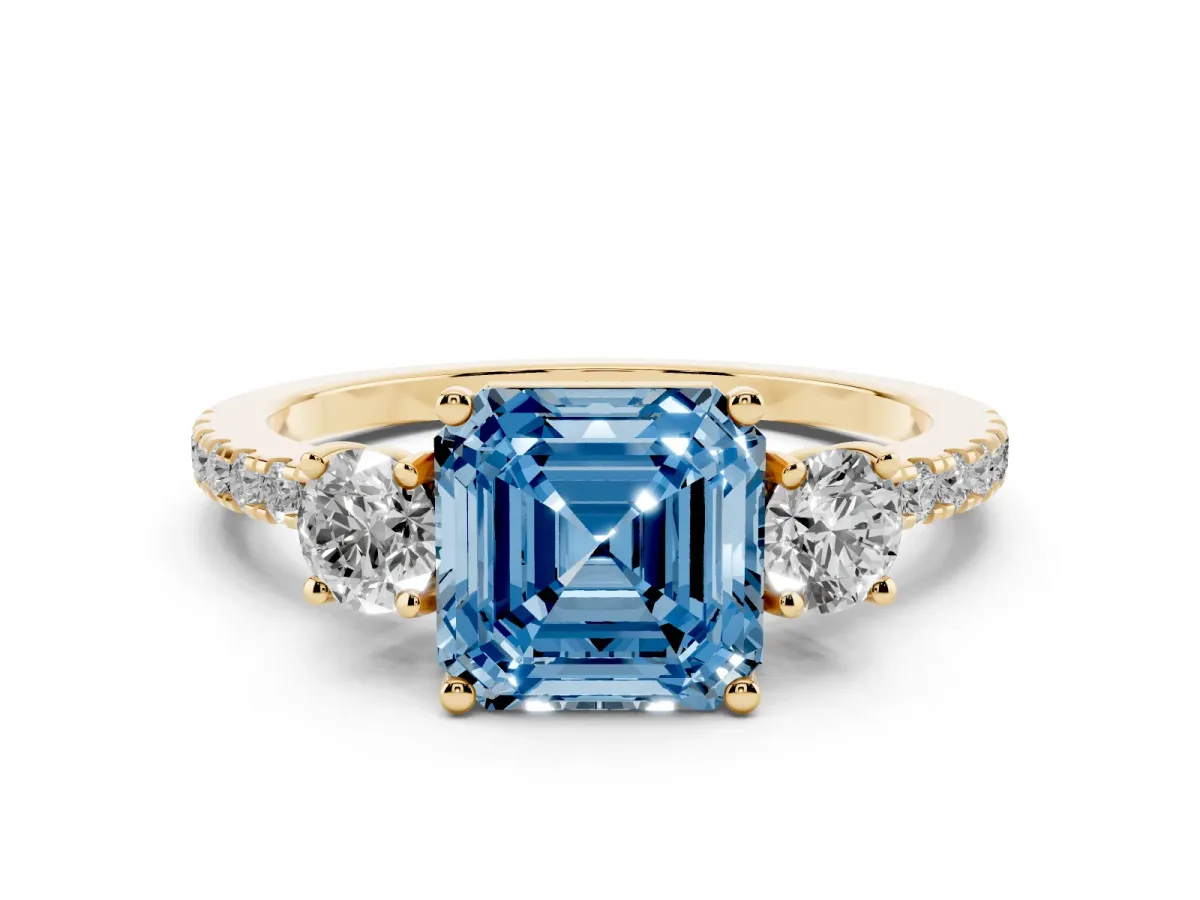 Fancy Blue Asscher Cut Diamond Three-Stone Ring Set in Yellow gold with Pavé Band and Graduated Sides