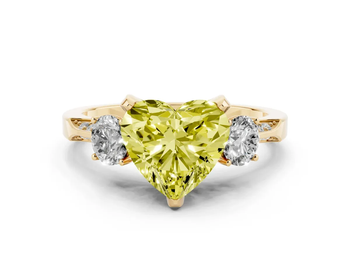 Fancy Yellow Heart Cut Diamond Three-Stone Ring Set in Yellow gold with Pavé Band and Smaller Side Stones