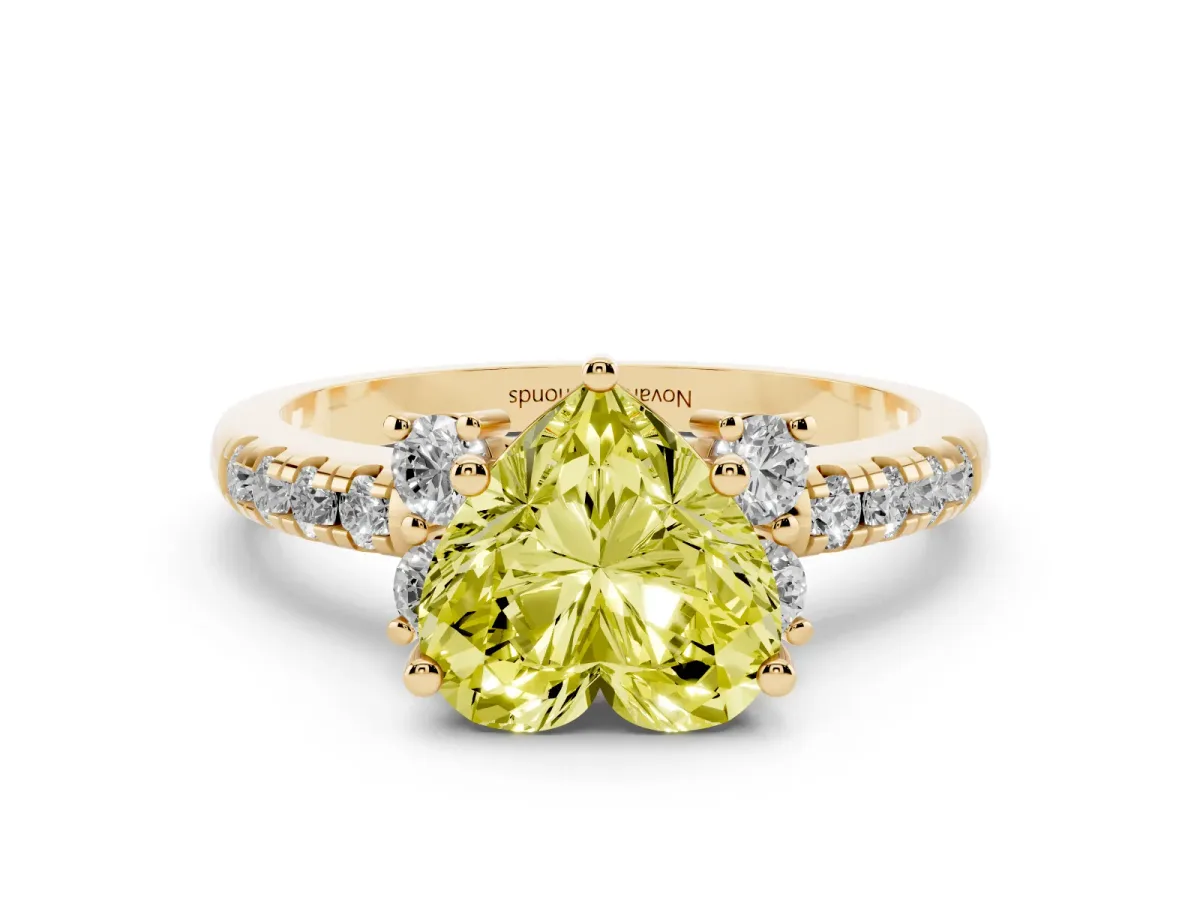 Fancy Yellow Heart Cut Diamond Three-Stone Pavé Ring Set in Yellow gold with Prong Setting