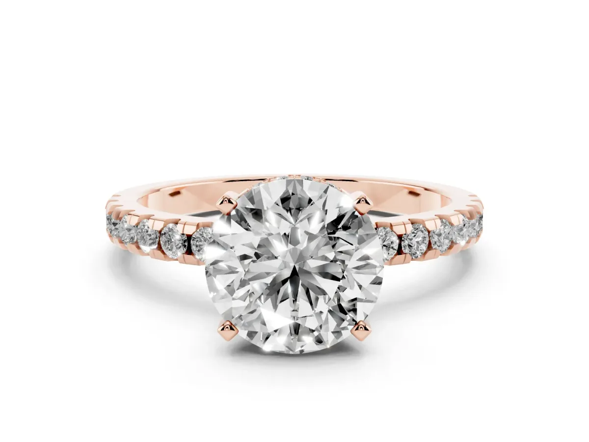 Round Cut Diamond Pavé Solitaire Ring Set in Rose gold with Round Band Accents and Prong Setting