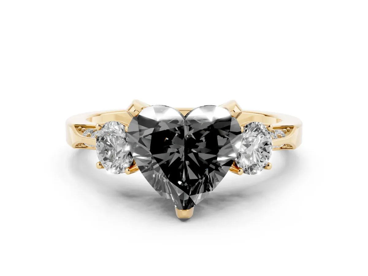 Fancy Black Heart Cut Diamond Three-Stone Ring Set in Yellow gold with Pavé Band and Smaller Side Stones