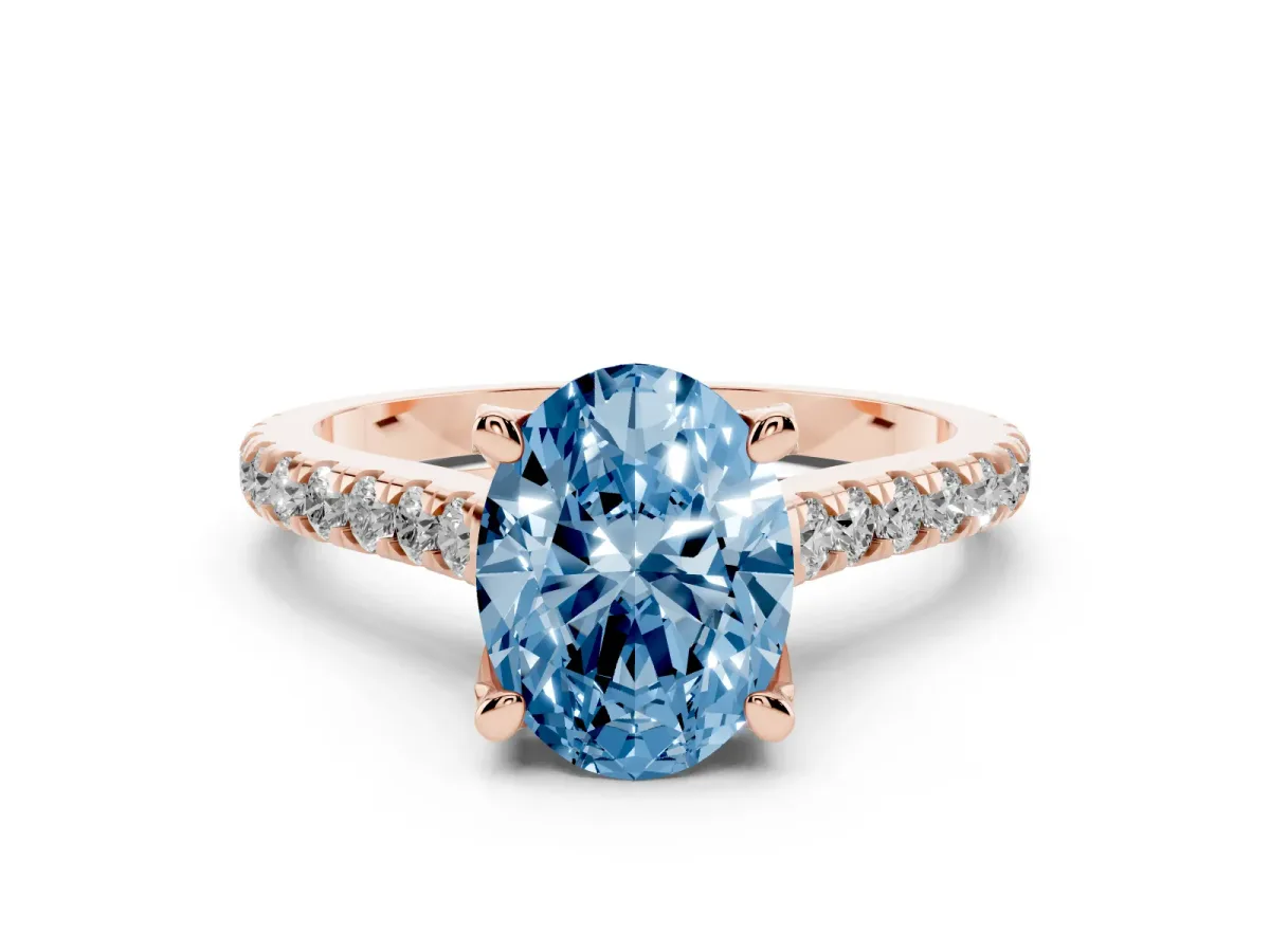 Fancy Blue Oval Cut Diamond Solitaire Ring Set in Rose gold with Brilliant Pavé Band and Prong Setting