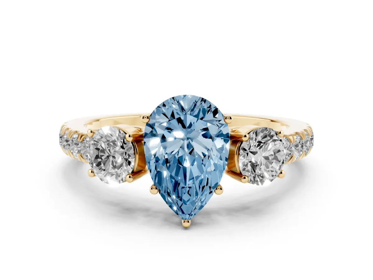Fancy Blue Pear Cut Diamond Three-Stone Ring Set in Yellow gold with Round Side Stones and Delicate Pavé Band