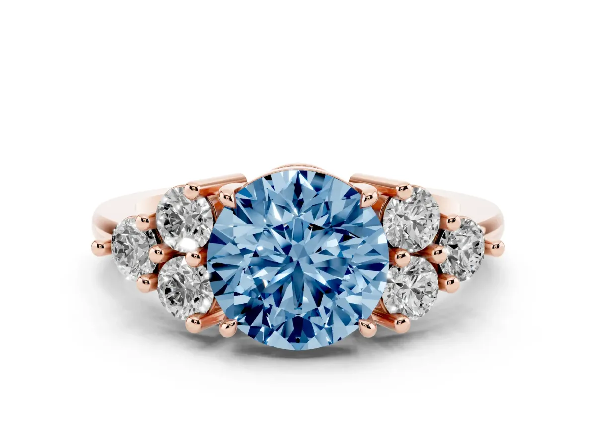 Fancy Blue Round Cut Diamond Solitaire Ring Set in Rose gold with Cluster Accents on Each Side
