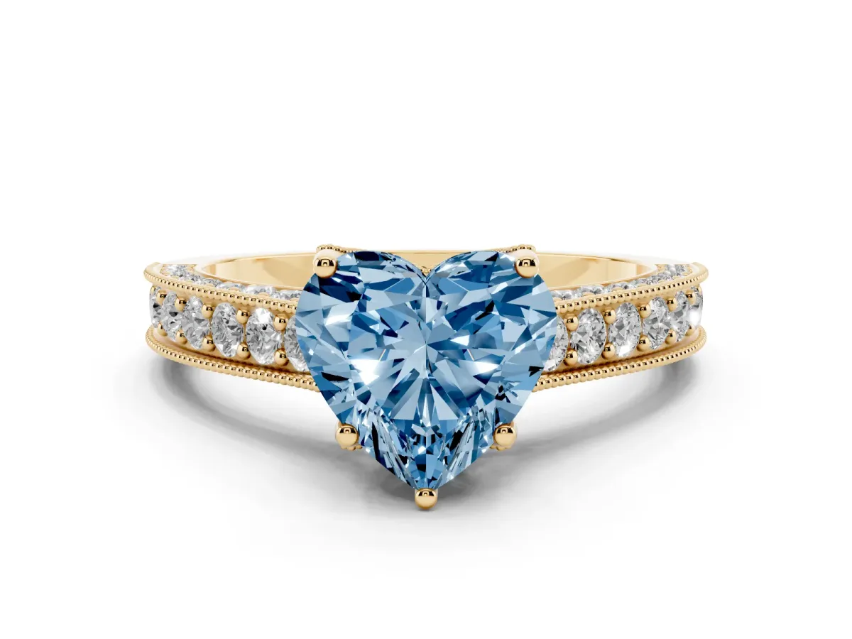 Fancy Blue Heart Cut Diamond Solitaire Ring Set in Yellow gold with Milgrain-Edged Pavé Band and Prong Setting