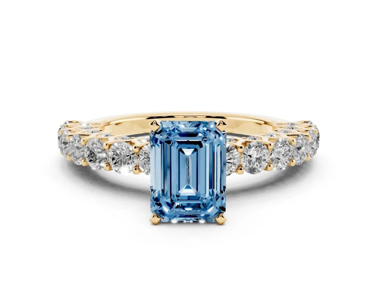 Fancy Blue Emerald Cut Diamond Solitaire Ring Set in Yellow gold with Shared Prong Pavé Band