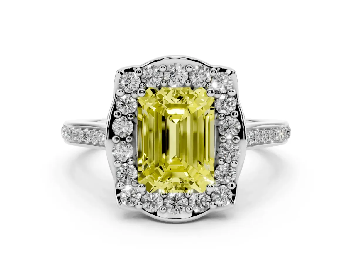 Fancy Yellow Emerald Cut Diamond Halo Ring Set in White gold with Pavé-Lined Shoulders and Prong Setting