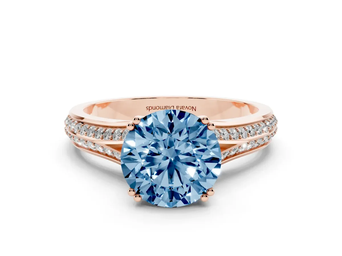 Fancy Blue Round Cut Diamond Split Shank Pavé Engagement Ring Set in Rose gold with Prong-Set Center Stone