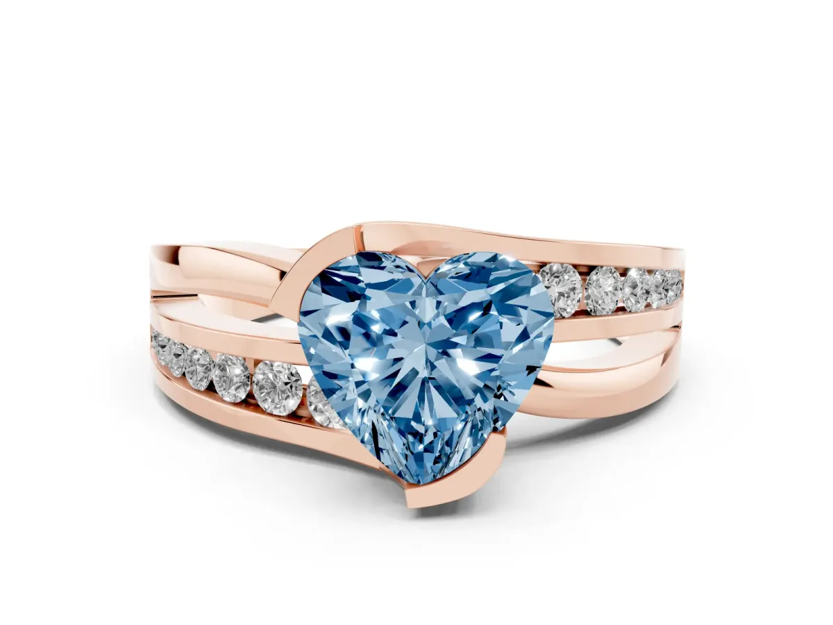Fancy Blue Heart Cut Diamond Solitaire Ring Set in Rose gold with Channel Set Split Shank and Tension Prongs