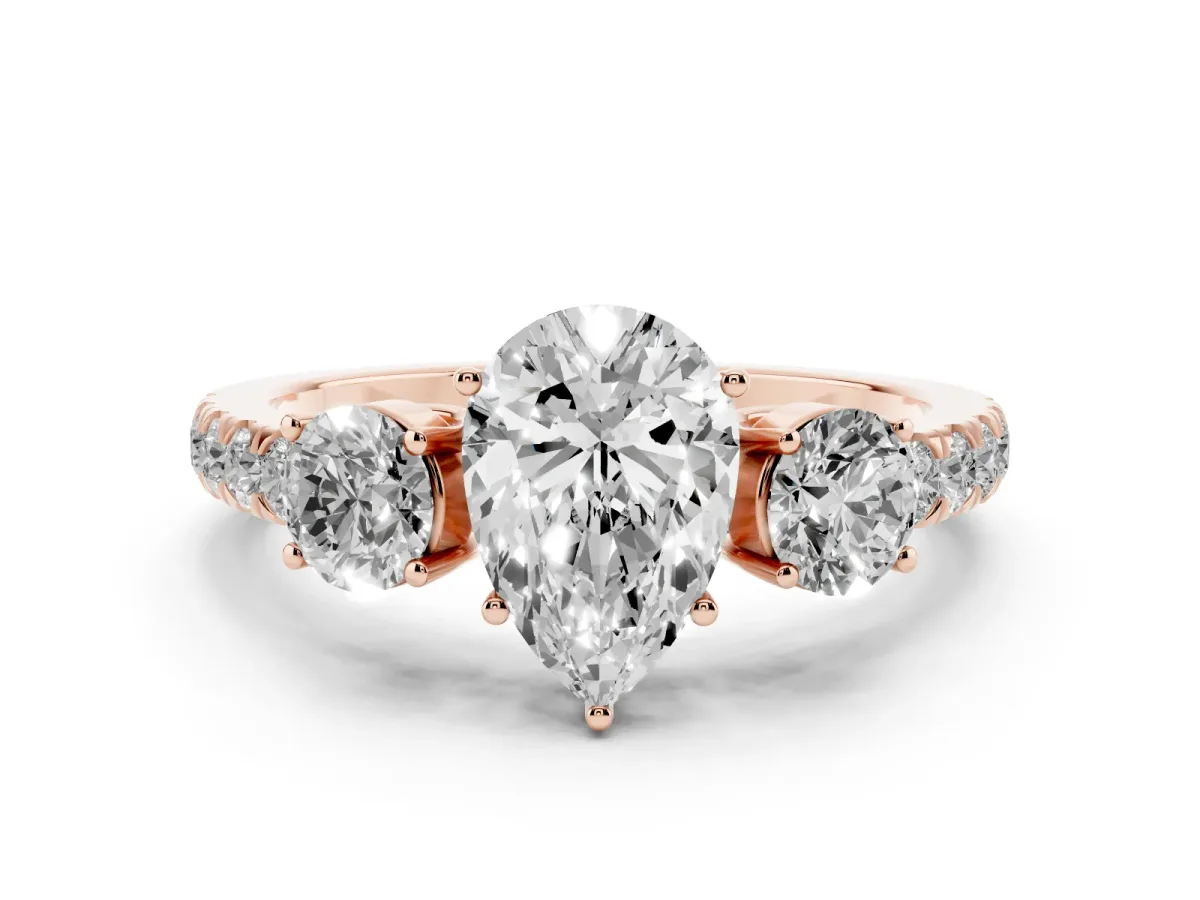 Pear Cut Diamond Three-Stone Ring Set in Rose gold with Round Side Stones and Delicate Pavé Band