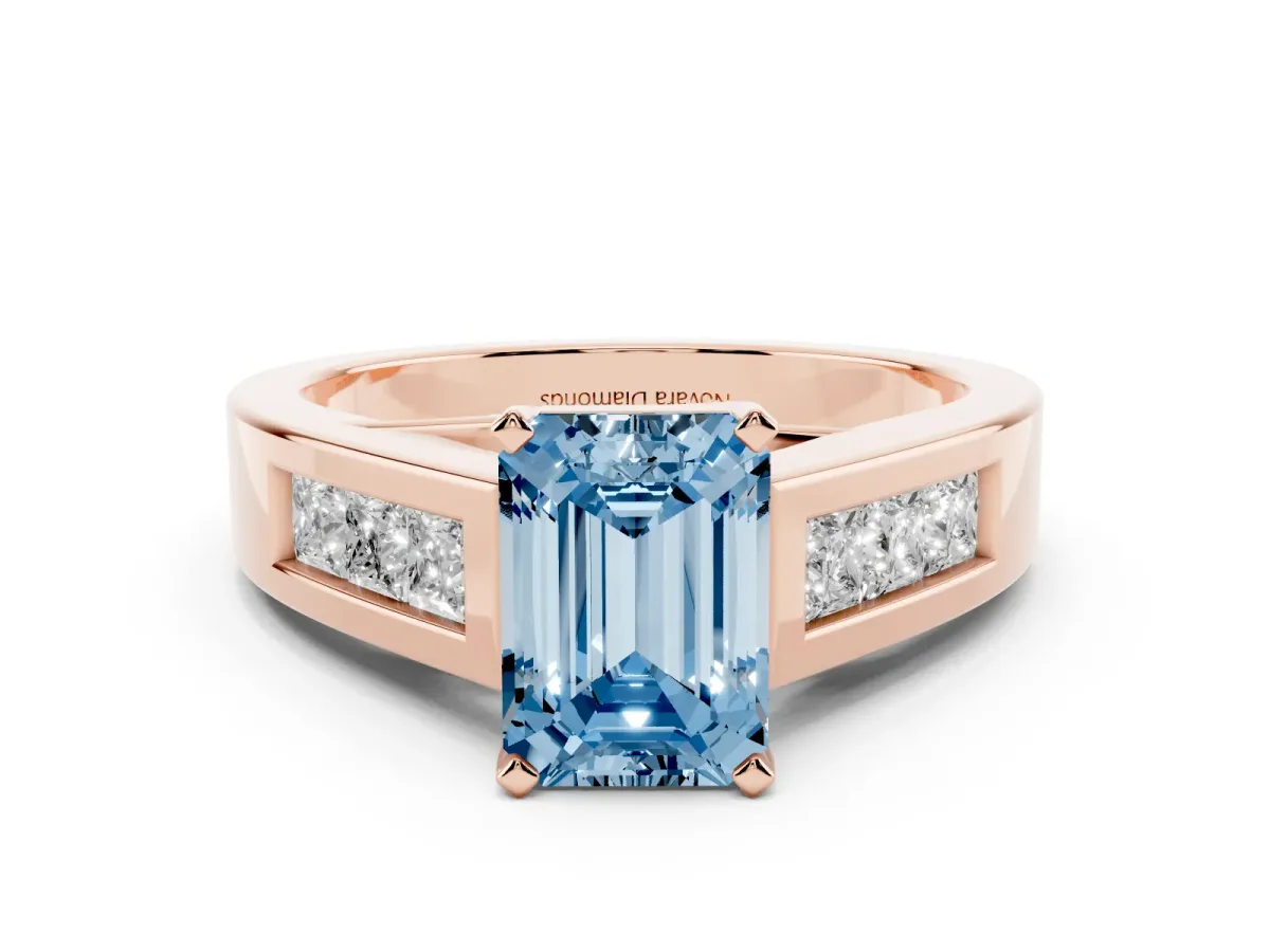 Fancy Blue Emerald Cut Diamond Solitaire Ring Set in Rose gold with Channel-Set Accent Stones and Prong Setting