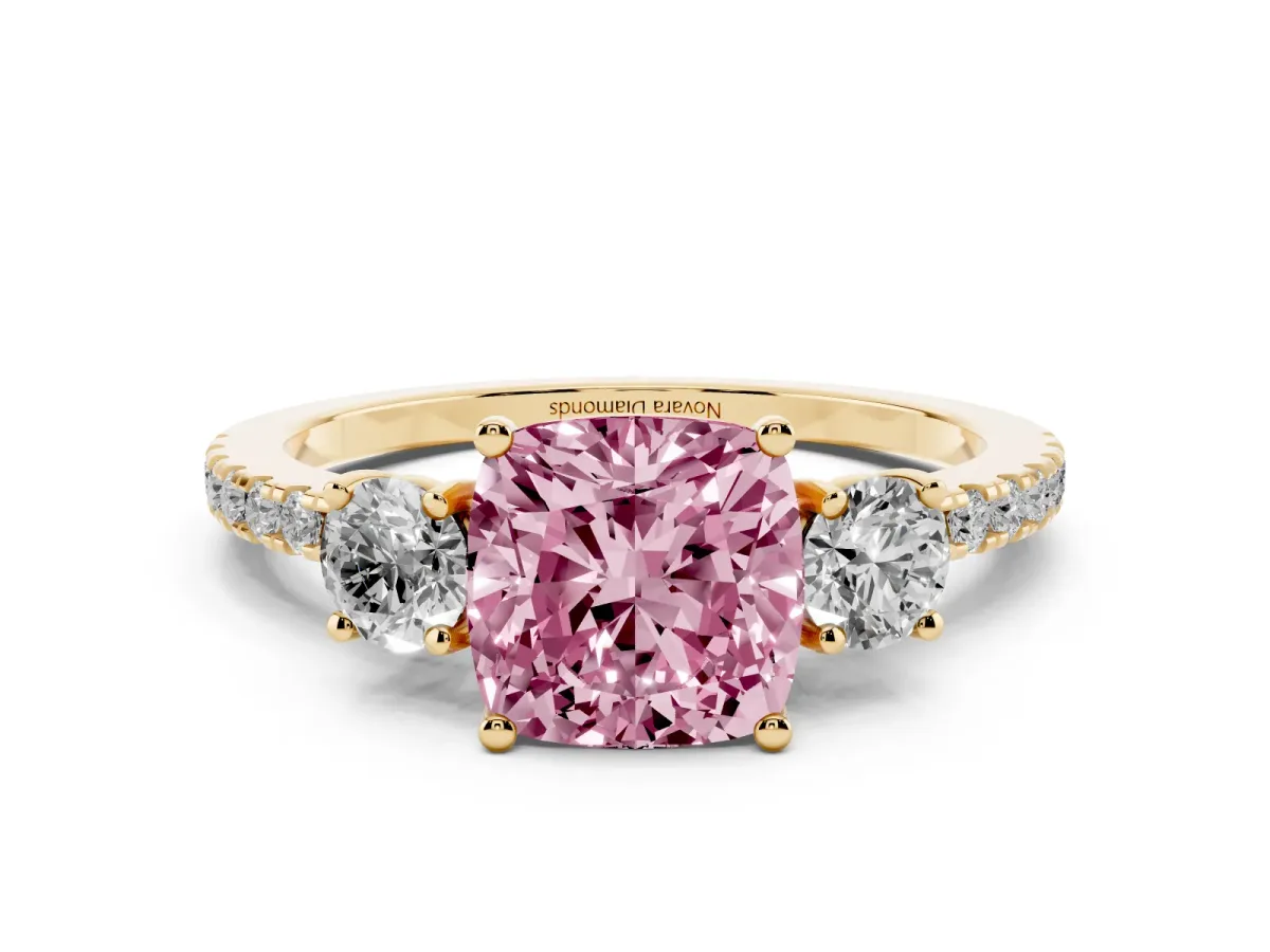Fancy Pink Cushion Cut Diamond Three-Stone Ring Set in Yellow gold with Pavé Band and Graduated Sides