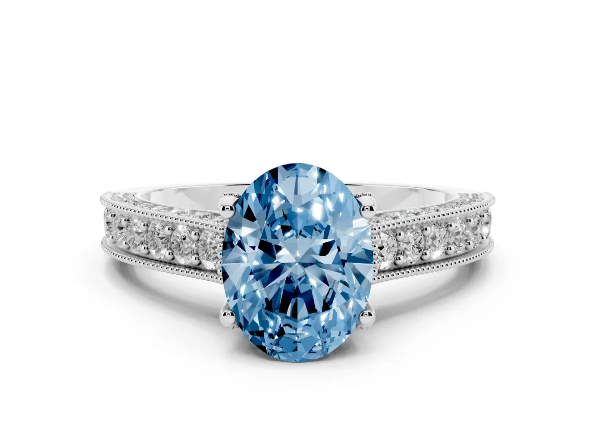 Fancy Blue Oval Cut Diamond Solitaire Ring Set in Platinum with Milgrain-Edged Pavé Band and Prong Setting