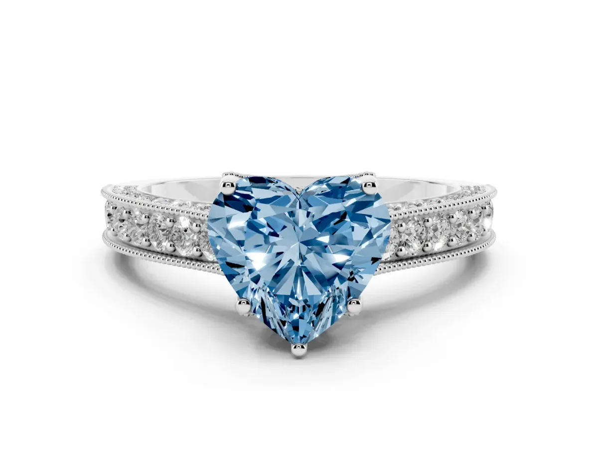 Fancy Blue Heart Cut Diamond Solitaire Ring Set in Platinum with Milgrain-Edged Pavé Band and Prong Setting