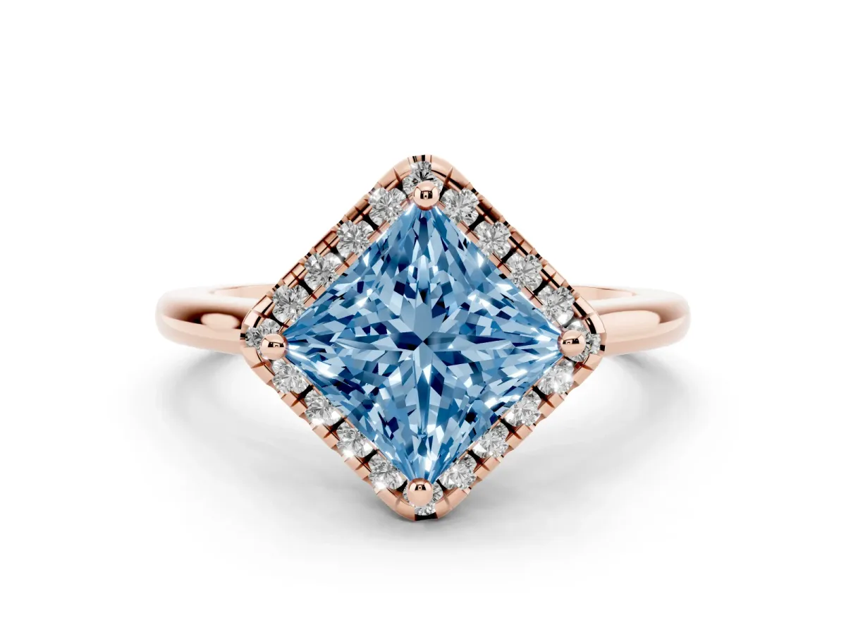Fancy Blue Princess Cut Diamond Halo Engagement Ring Set in Rose gold with Pavé Band and Rising Shoulders