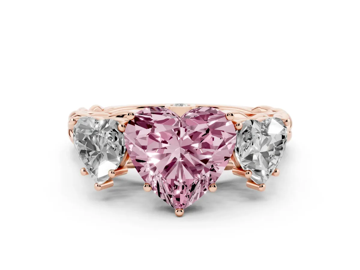 Fancy Pink Heart Cut Diamond Three-Stone Ring Set in Rose gold with Braided Band
