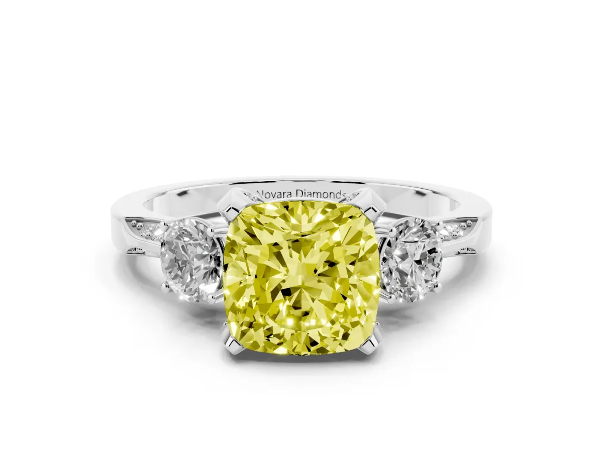 Fancy Yellow Cushion Cut Diamond Three-Stone Ring Set in White gold with Pavé Band and Smaller Side Stones