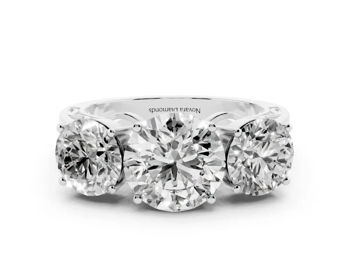 Round Cut Diamond Three-Stone Ring Set in Platinum with Textured Band