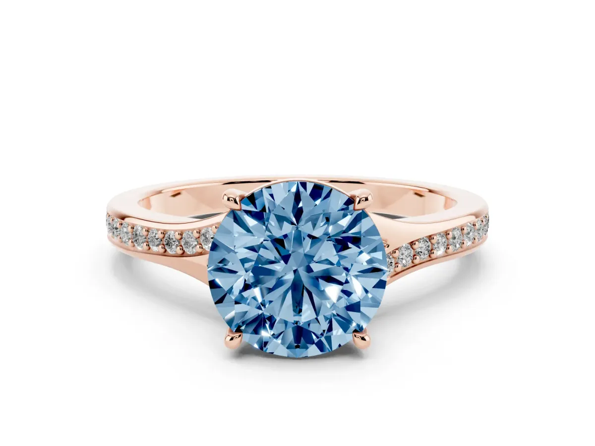 Fancy Blue Round Cut Diamond Solitaire Ring Set in Rose gold with Pavé Accent Band and Classic Prong Setting