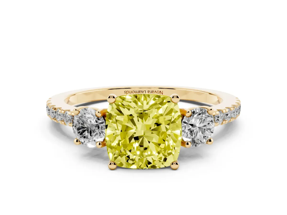Fancy Yellow Cushion Cut Diamond Three-Stone Ring Set in Yellow gold with Pavé Band and Graduated Sides