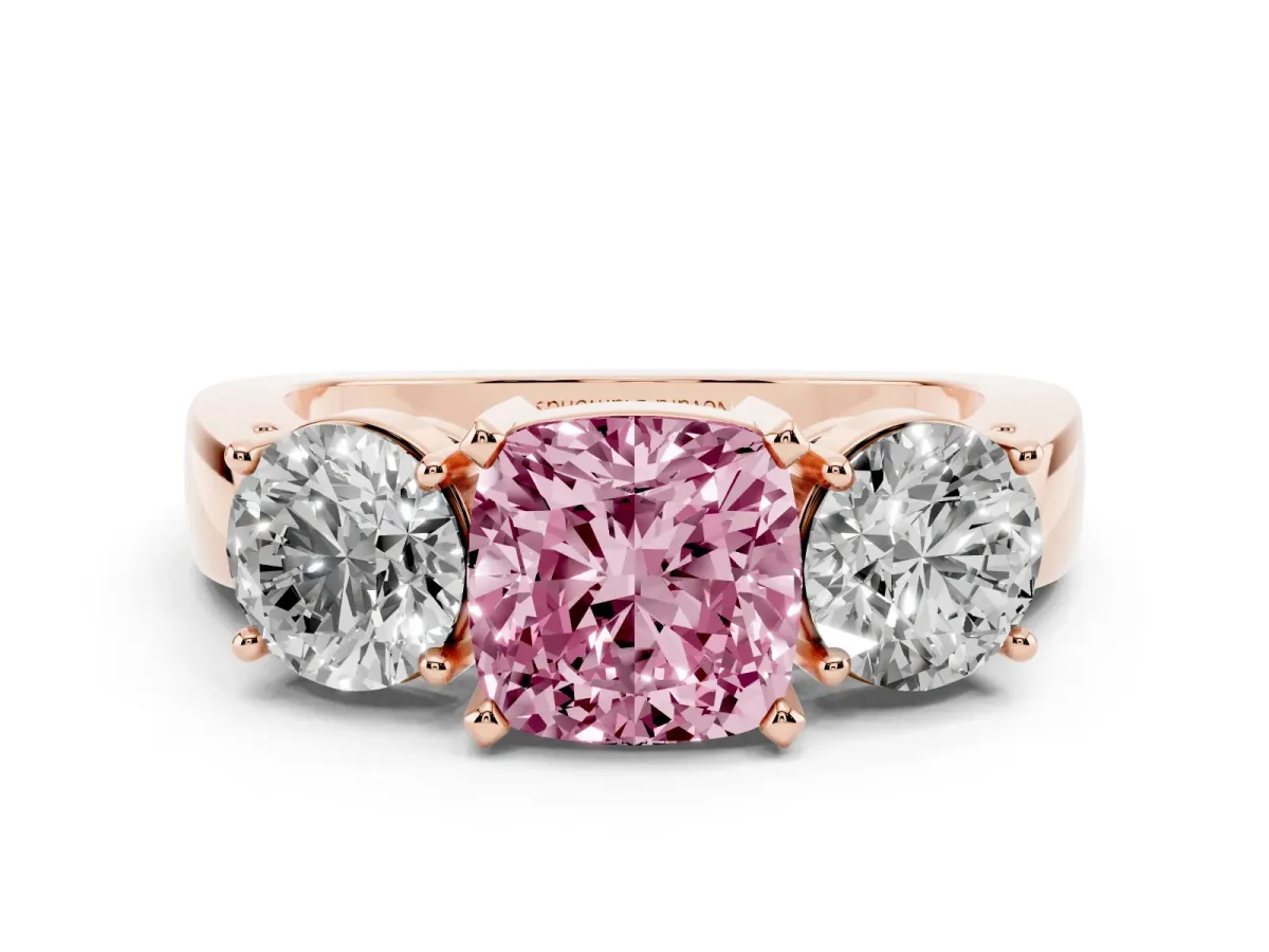 Fancy Pink Cushion Cut Diamond Three-Stone Ring Set in Rose gold with Round Side Stones and Classic Band