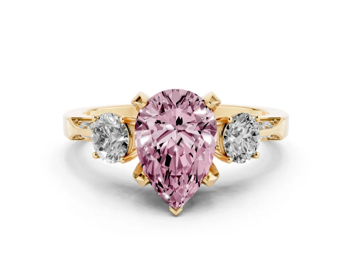 Fancy Pink Pear Cut Diamond Three-Stone Ring Set in Yellow gold with Pavé Band and Smaller Side Stones