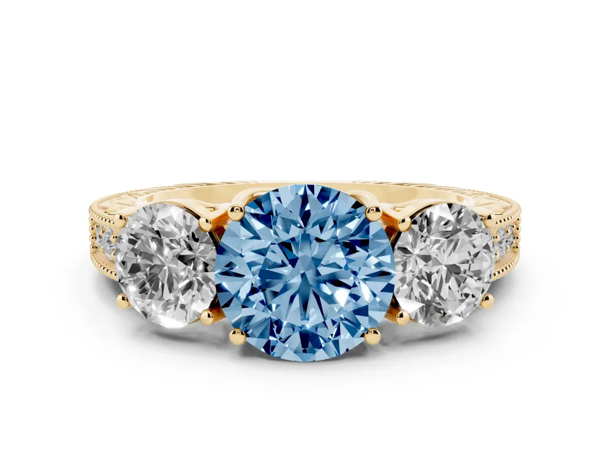 Fancy Blue Round Cut Diamond Three-Stone Engagement Ring Set in Yellow gold with Milgrain Pavé Band