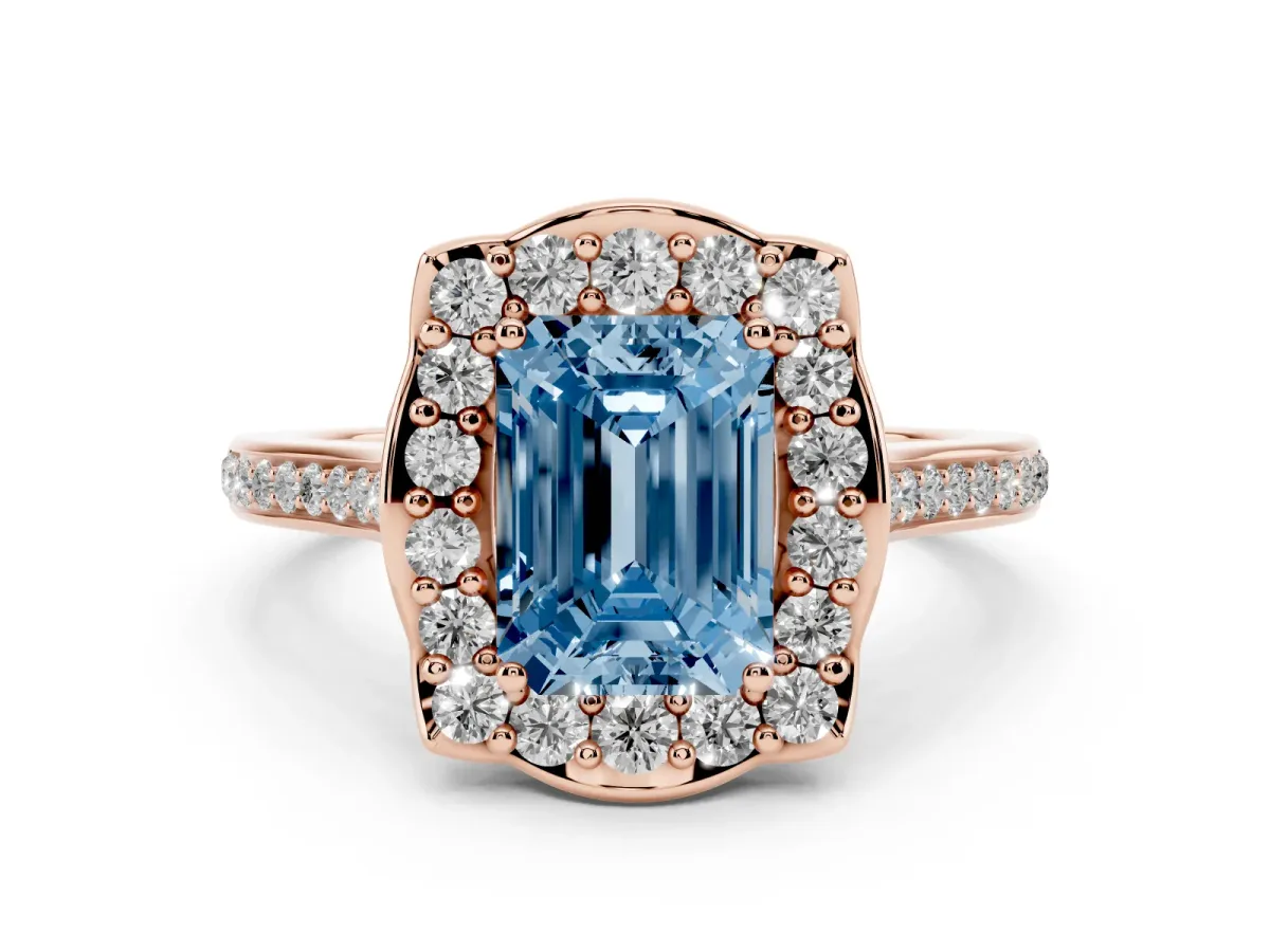 Fancy Blue Emerald Cut Diamond Halo Ring Set in Rose gold with Pavé-Lined Shoulders and Prong Setting