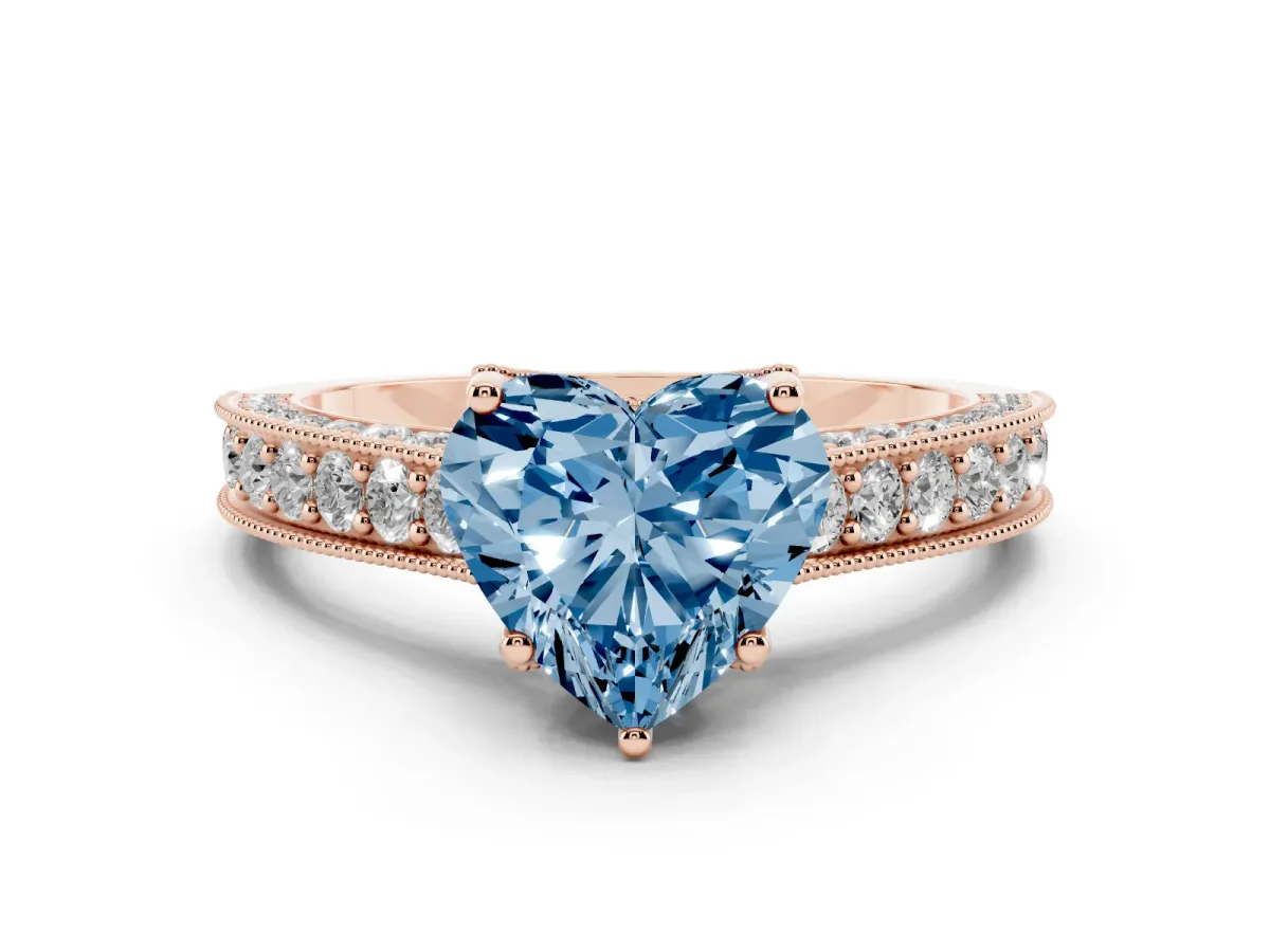 Fancy Blue Heart Cut Diamond Solitaire Ring Set in Rose gold with Milgrain-Edged Pavé Band and Prong Setting