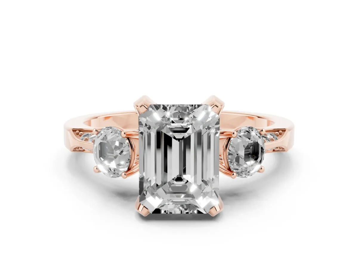 Emerald Cut Diamond Three-Stone Ring Set in Rose gold with Pavé Band and Smaller Side Stones