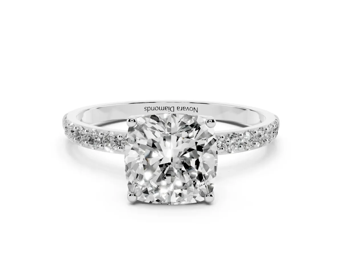 Cushion Cut Diamond Solitaire Engagement Ring Set in Platinum with Round Pavé Band and Prong Setting