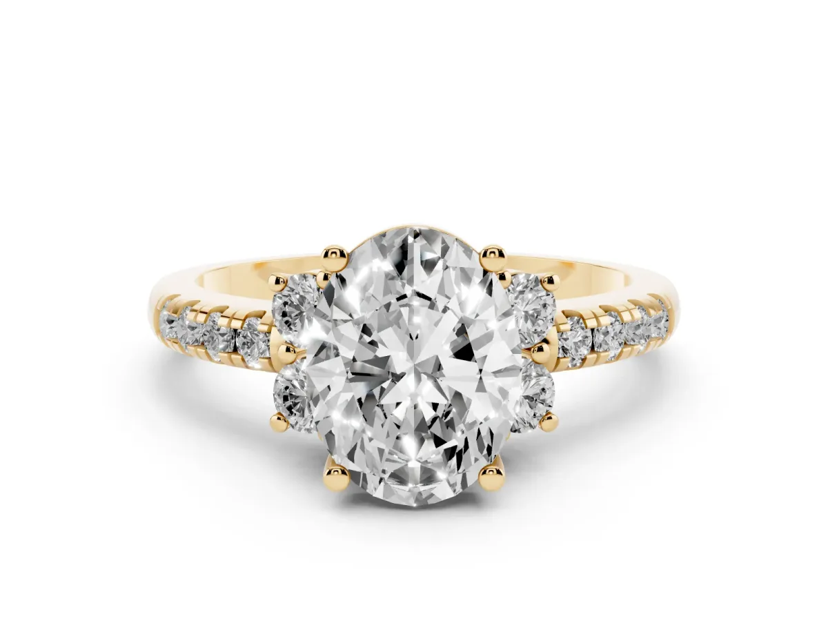 Oval Cut Diamond Three-Stone Pavé Ring Set in Yellow gold with Prong Setting
