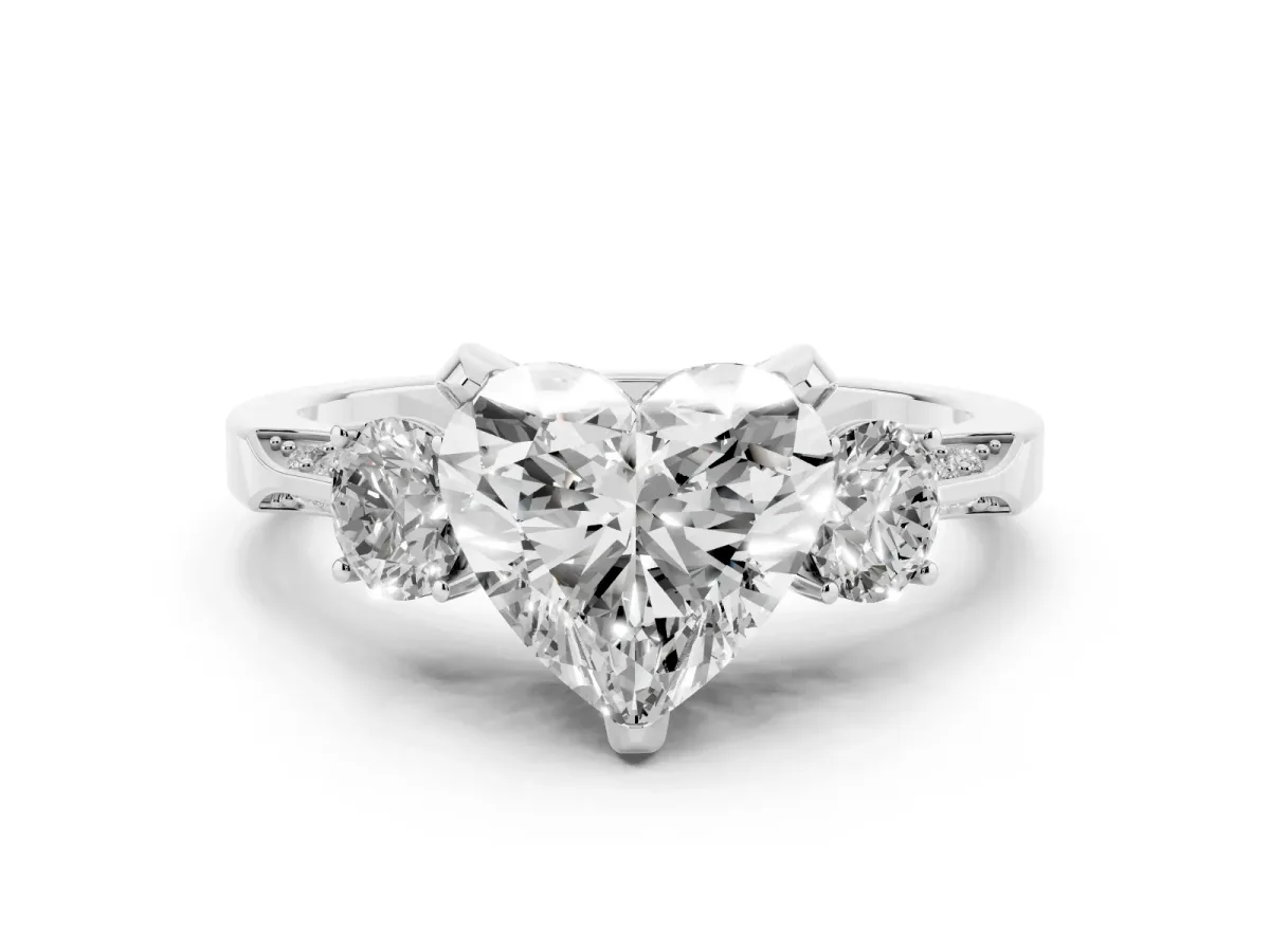 Heart Cut Diamond Three-Stone Ring Set in Platinum with Pavé Band and Smaller Side Stones